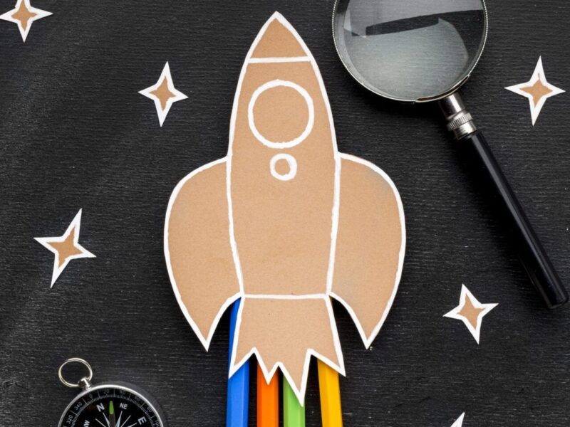 back-school-rocket-with-magnifying-glass-pencils